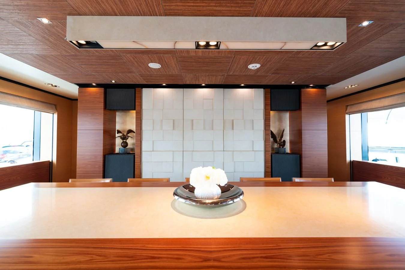 a large room with a large white cake on a round plate aboard ALI BABA Yacht for Sale