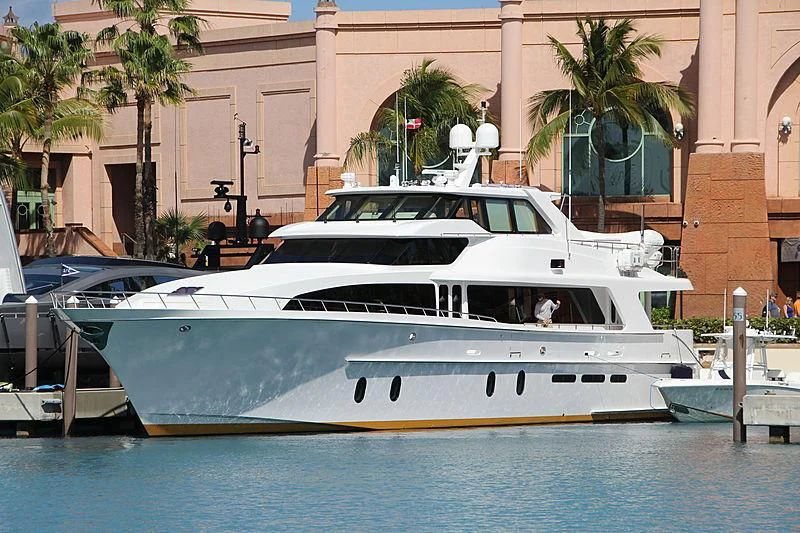 a white yacht in a harbor aboard BLUE STEELE Yacht for Sale