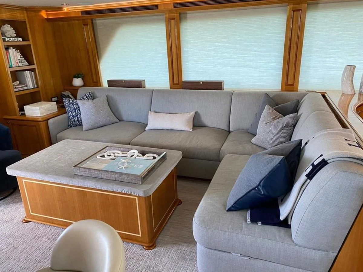 a living room with a couch and coffee table aboard BLUE STEELE Yacht for Sale