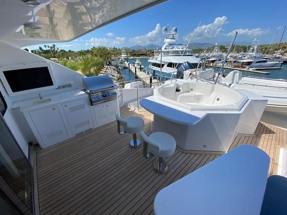 a deck with a view of a marina and boats aboard BLUE STEELE Yacht for Sale