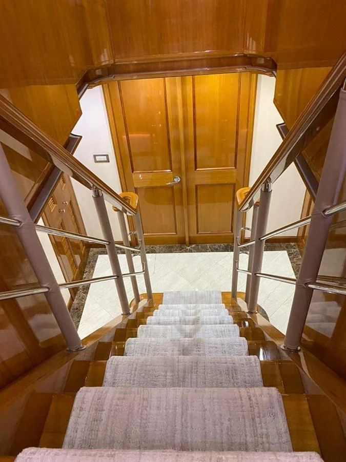 a staircase leading to a door aboard BLUE STEELE Yacht for Sale