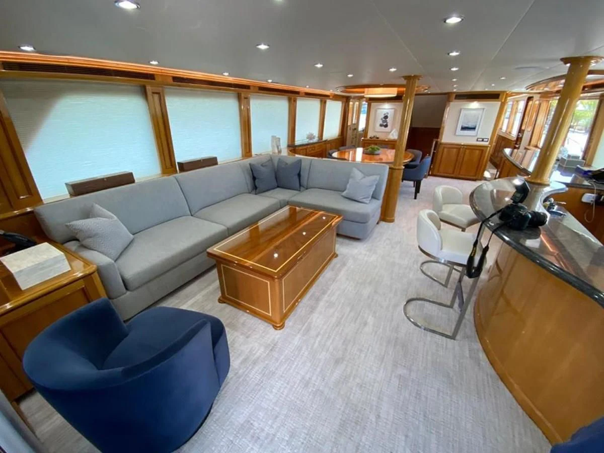 a living room with a couch and a table aboard BLUE STEELE Yacht for Sale