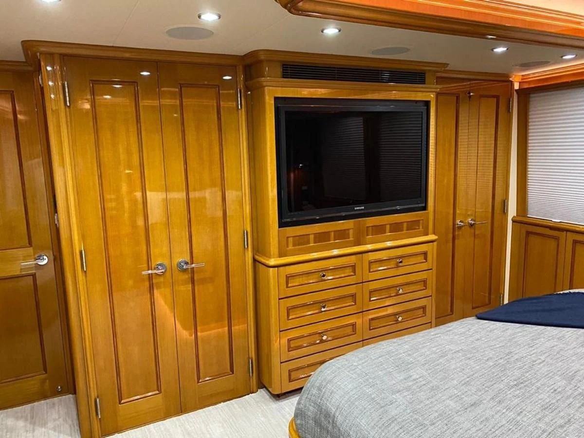 a bedroom with a tv and a bed aboard BLUE STEELE Yacht for Sale