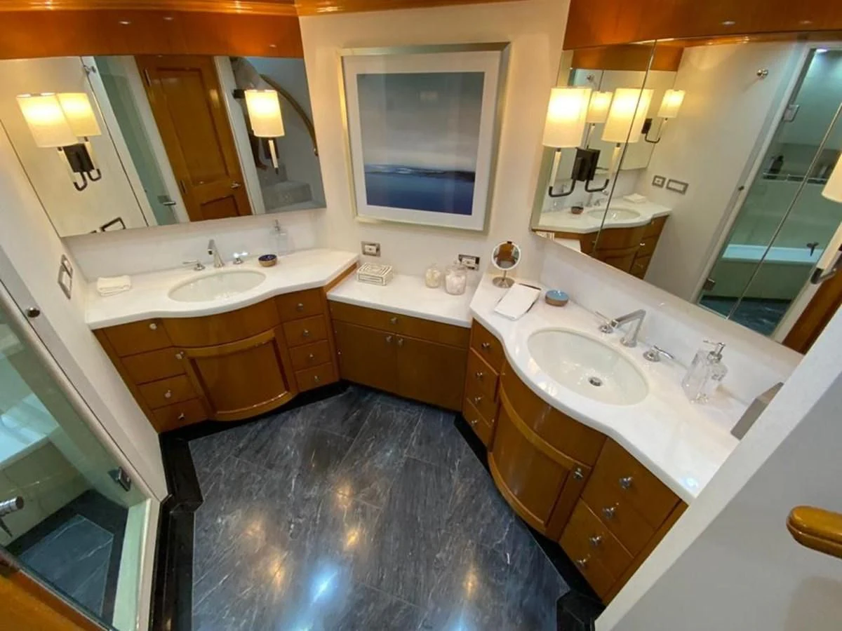 a bathroom with sinks and mirrors aboard BLUE STEELE Yacht for Sale