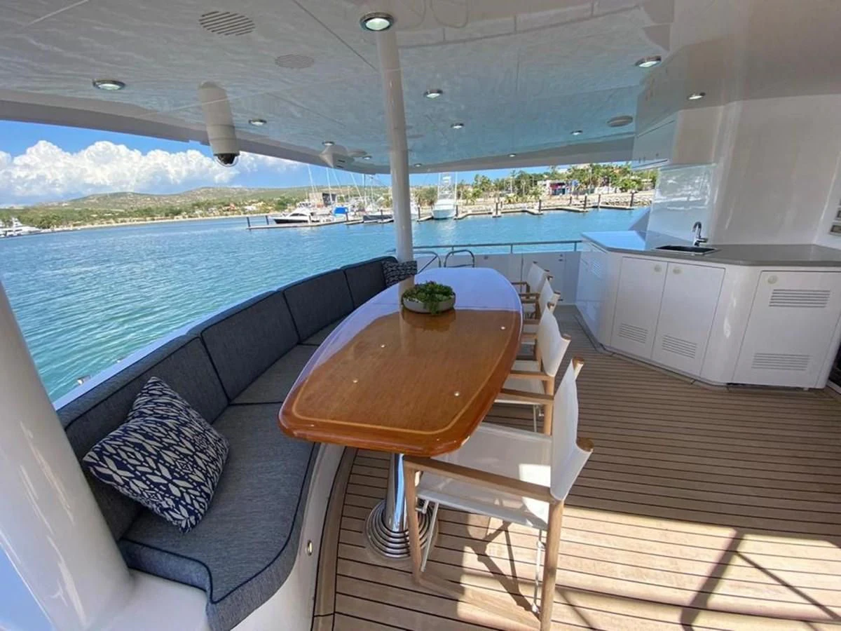 a table and chairs on a deck aboard BLUE STEELE Yacht for Sale