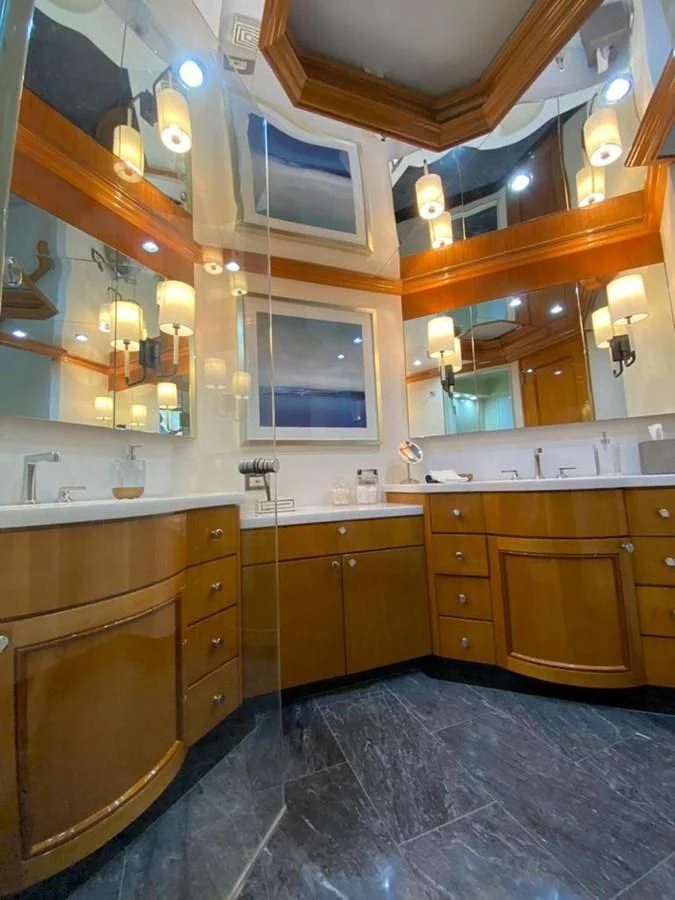 a bathroom with a large mirror aboard BLUE STEELE Yacht for Sale