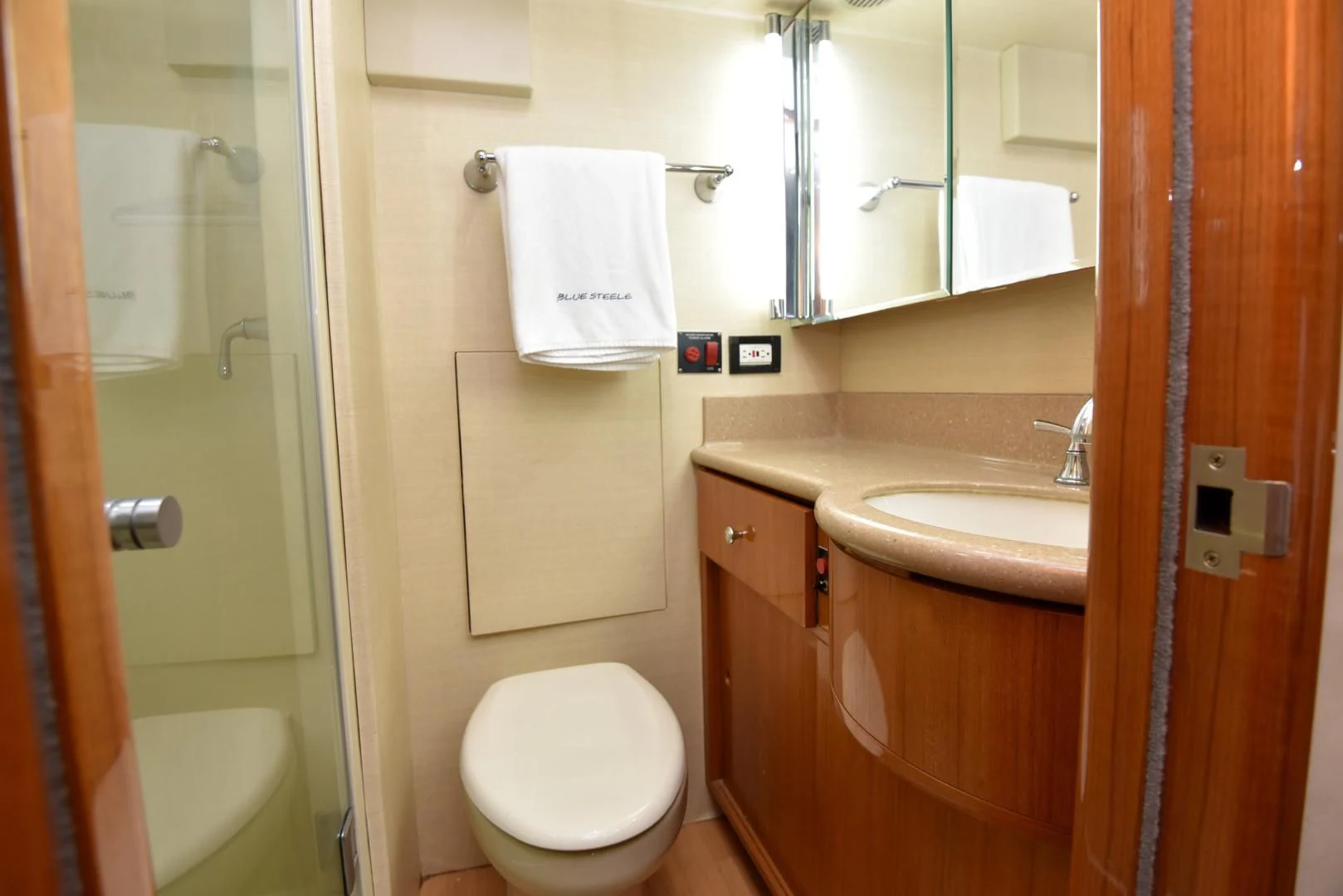 a bathroom with a toilet and sink aboard BLUE STEELE Yacht for Sale