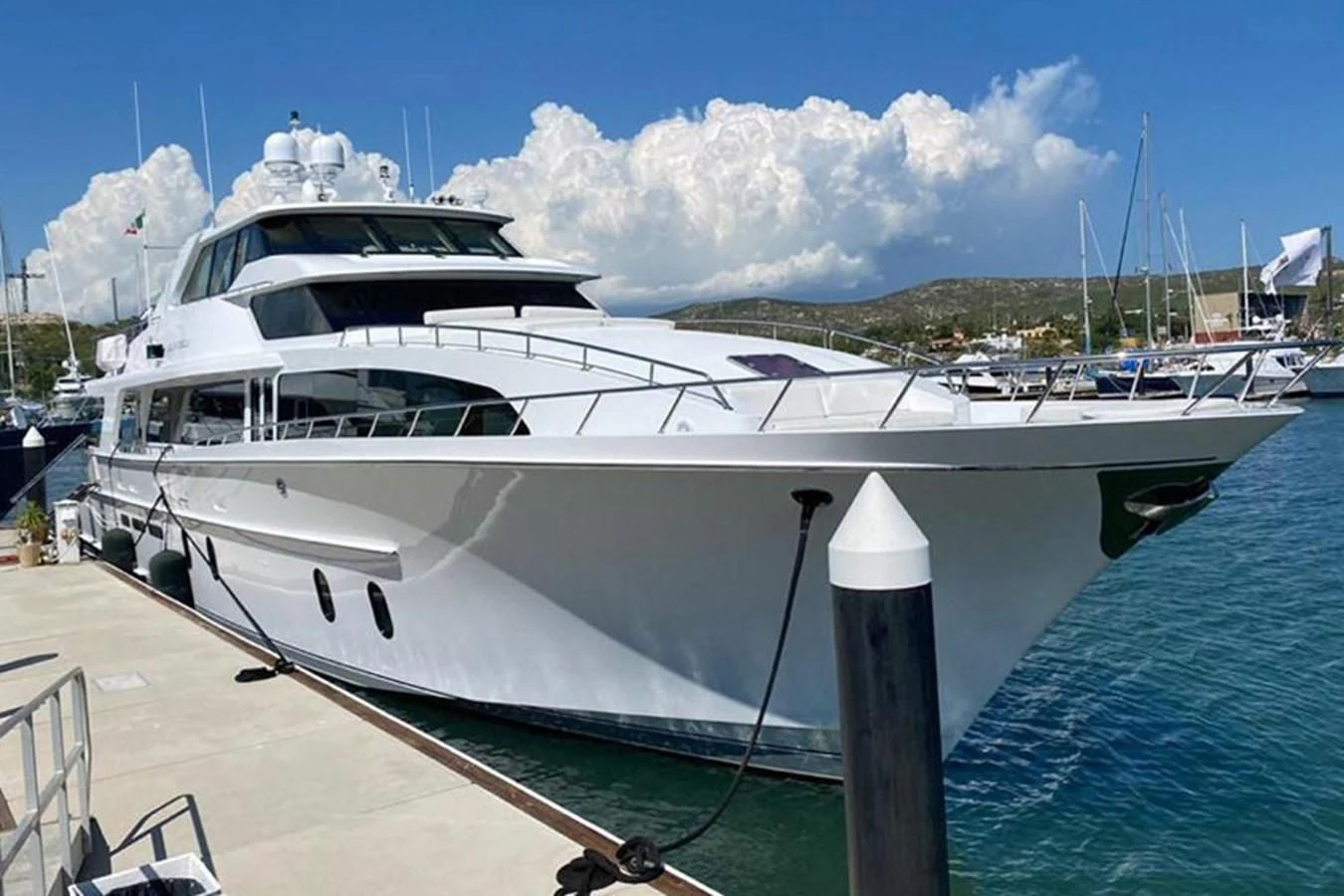 a white yacht docked at a pier aboard BLUE STEELE Yacht for Sale
