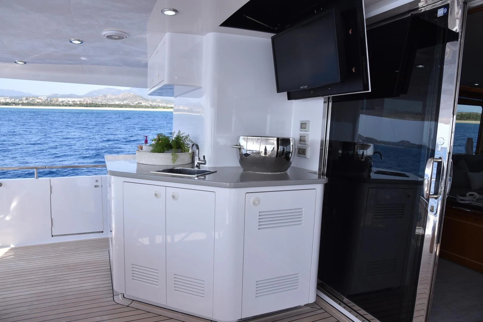 a kitchen with white cabinets aboard BLUE STEELE Yacht for Sale
