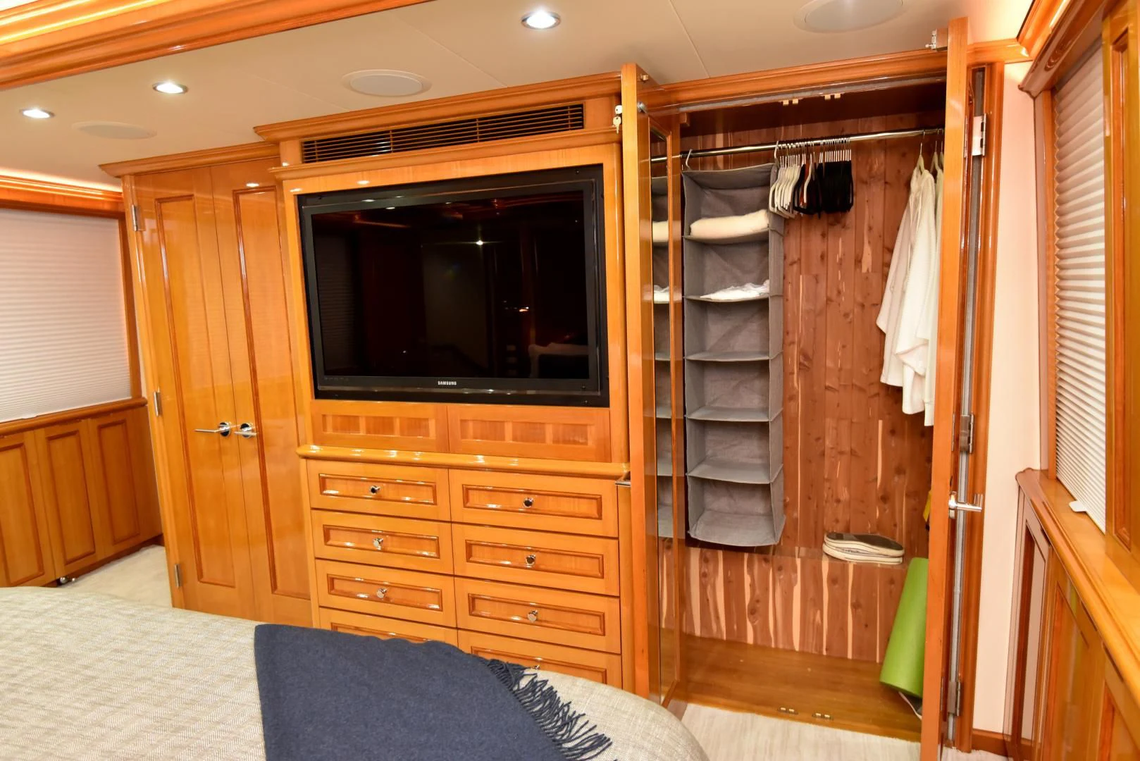 a room with a tv and closet aboard BLUE STEELE Yacht for Sale
