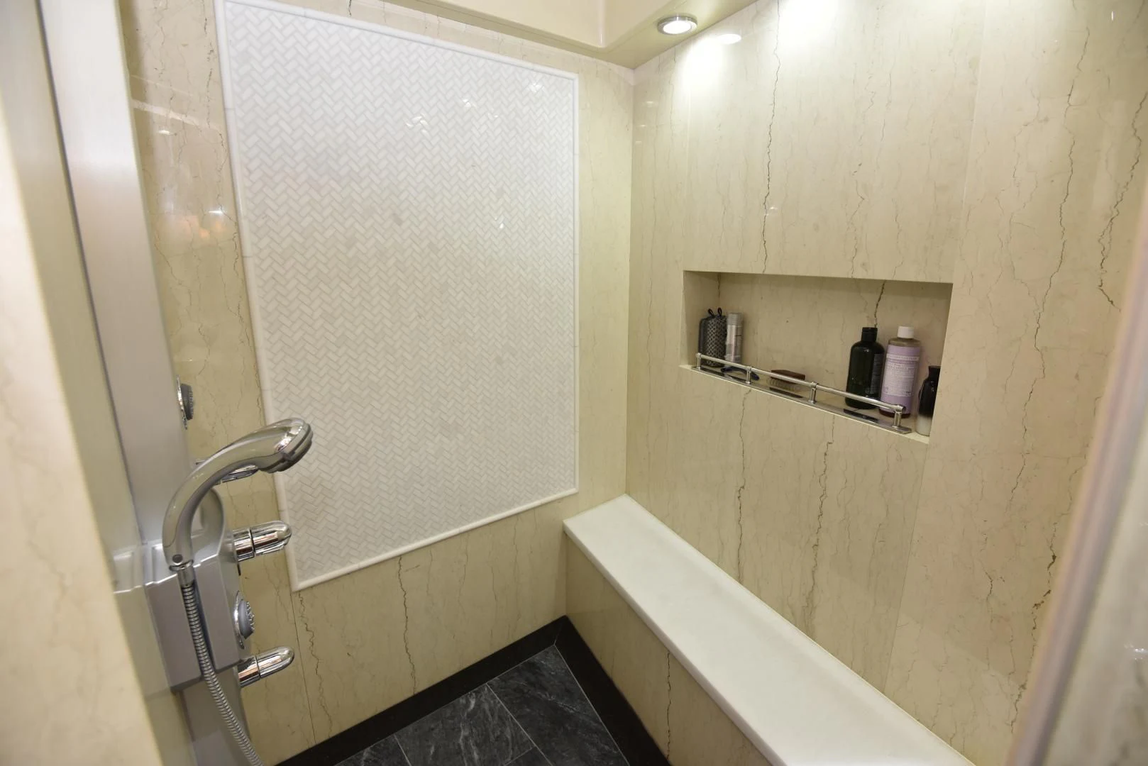 a bathroom with a tub and a sink aboard BLUE STEELE Yacht for Sale