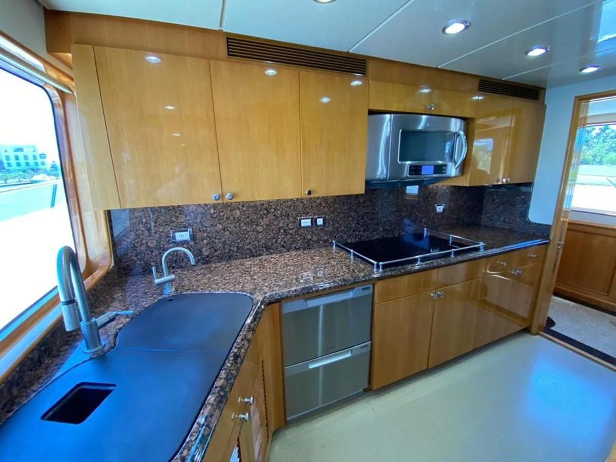 a kitchen with a large island aboard BLUE STEELE Yacht for Sale