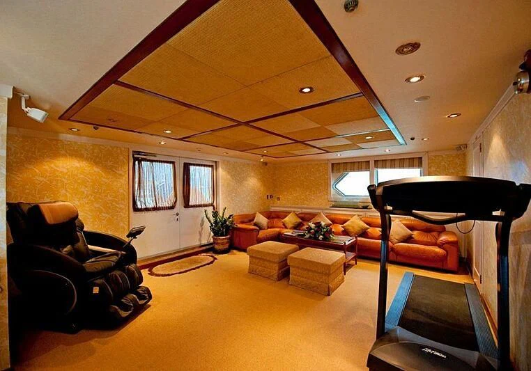 a living room with a piano aboard LANGKAWI LADY Yacht for Sale