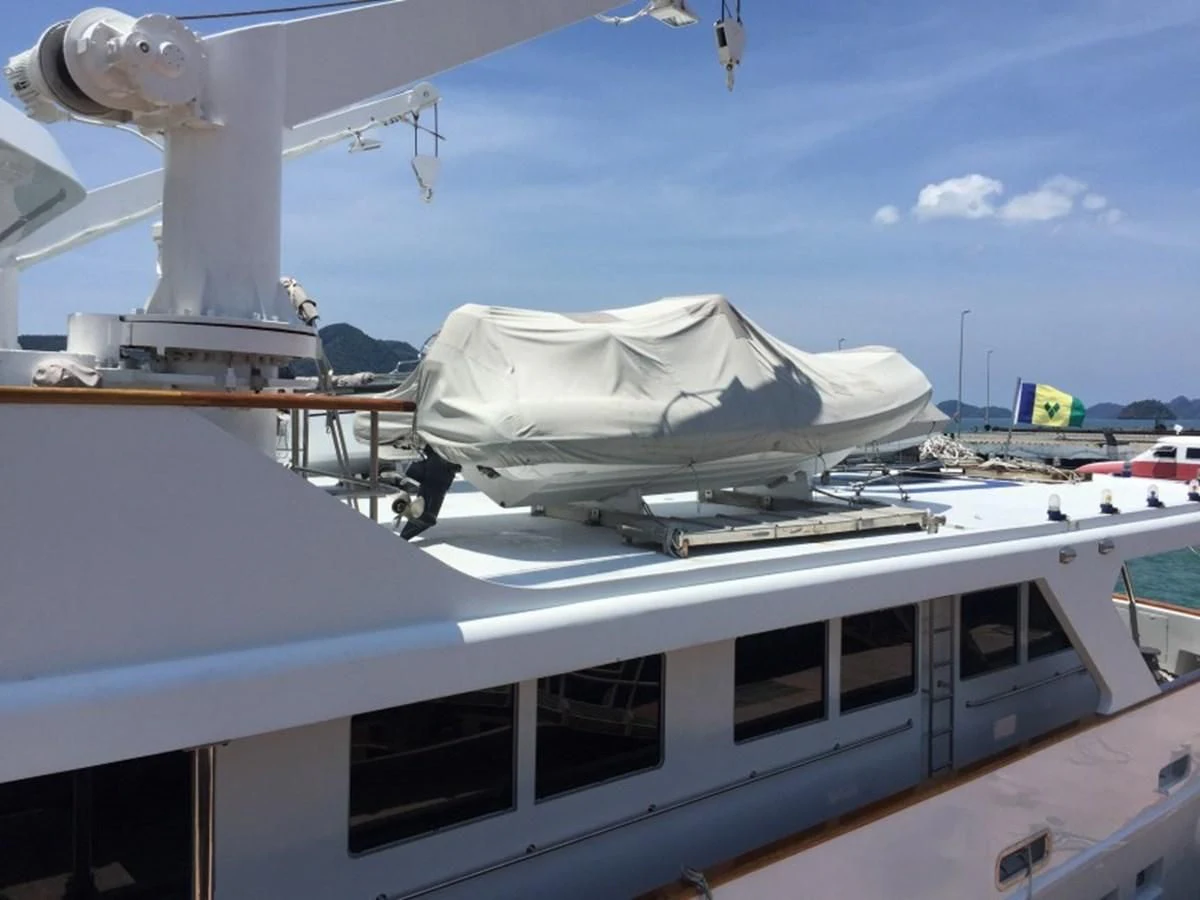 a white boat on a dock aboard LANGKAWI LADY Yacht for Sale