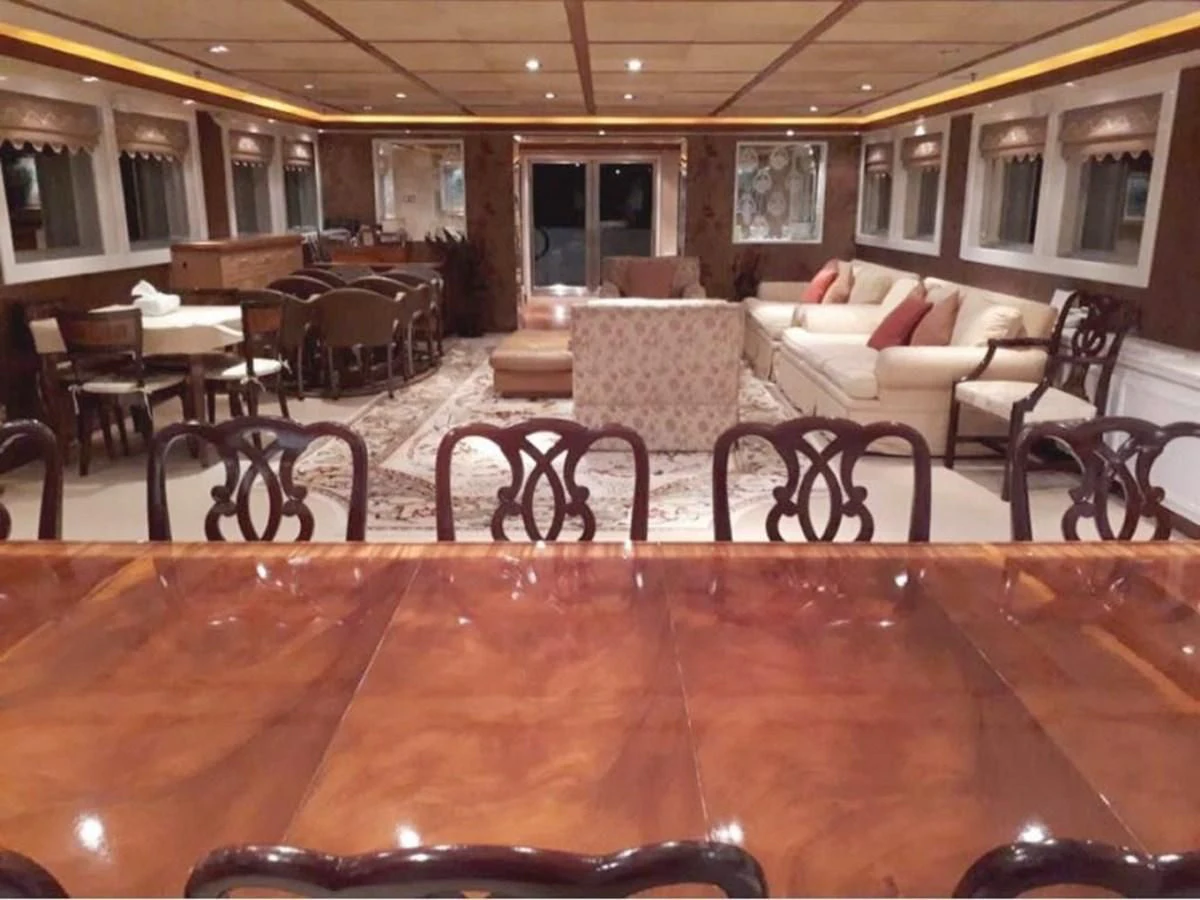 a restaurant with tables and chairs aboard LANGKAWI LADY Yacht for Sale