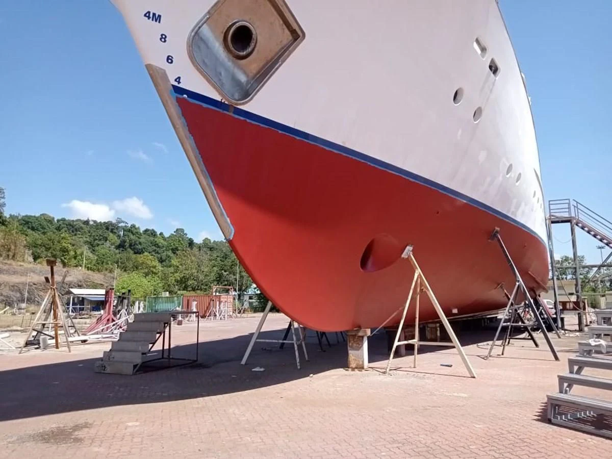 a large white boat on a beach aboard LANGKAWI LADY Yacht for Sale