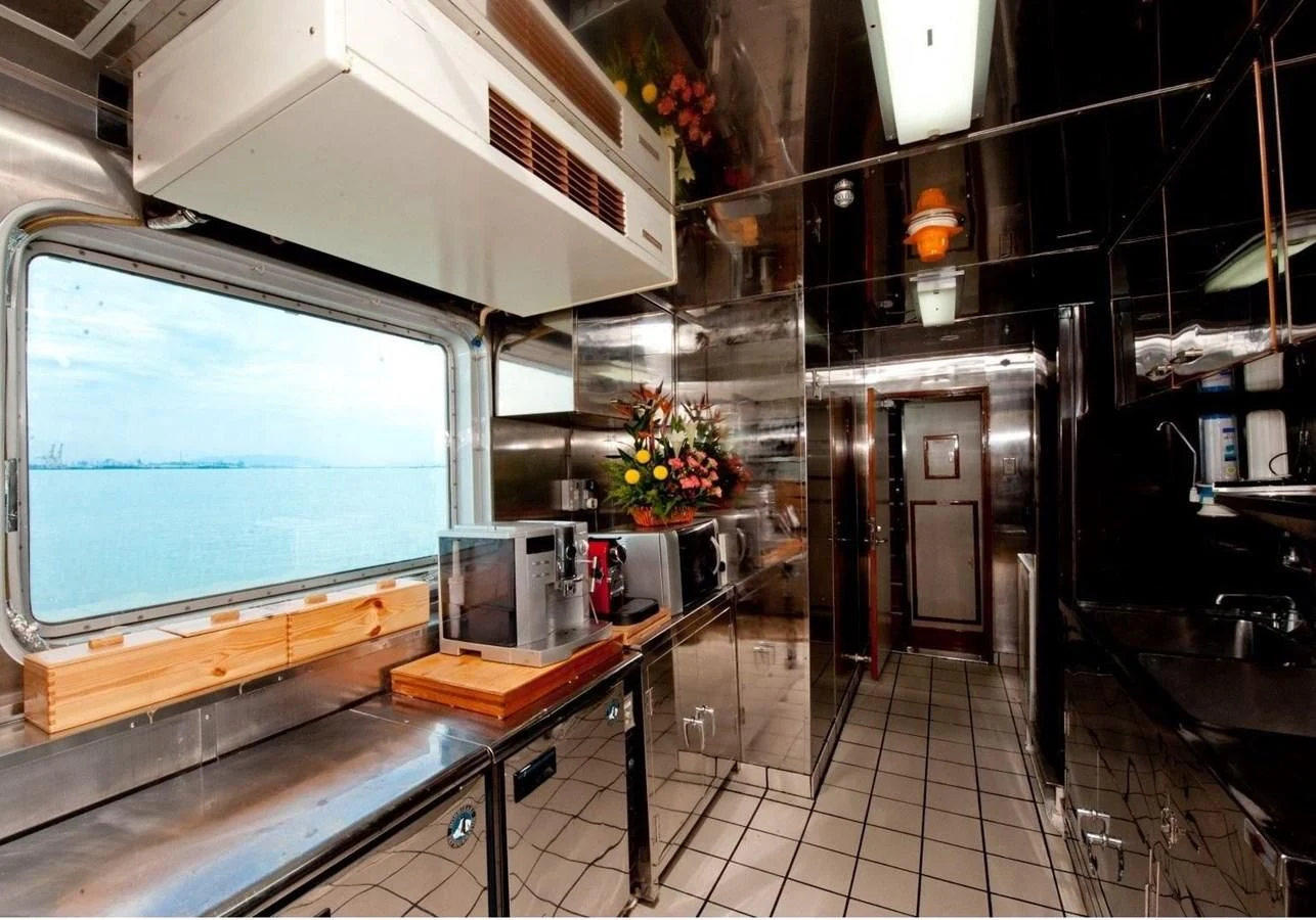 a room with a large window and a large screen aboard LANGKAWI LADY Yacht for Sale