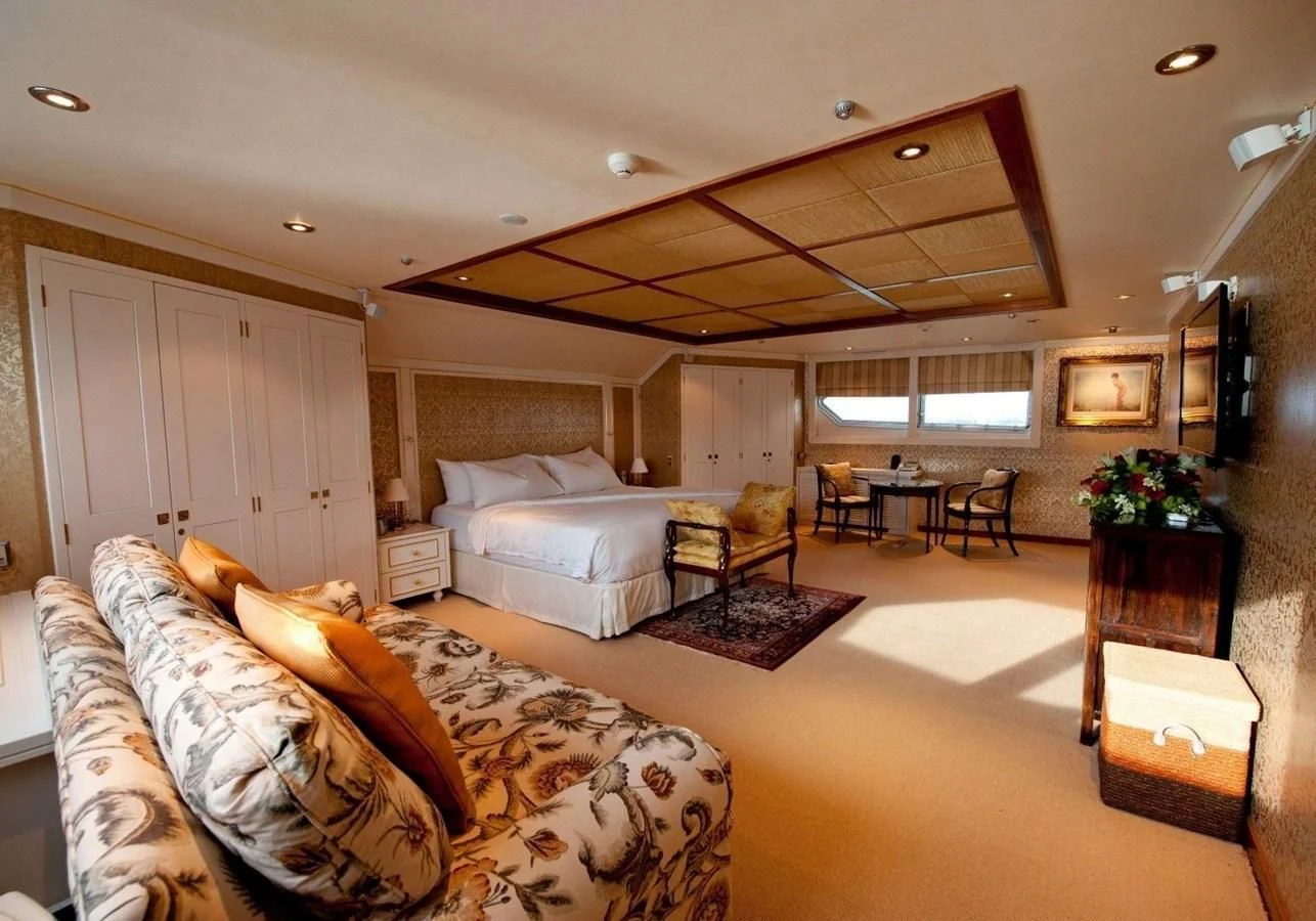 a large living room with a large ceiling aboard LANGKAWI LADY Yacht for Sale