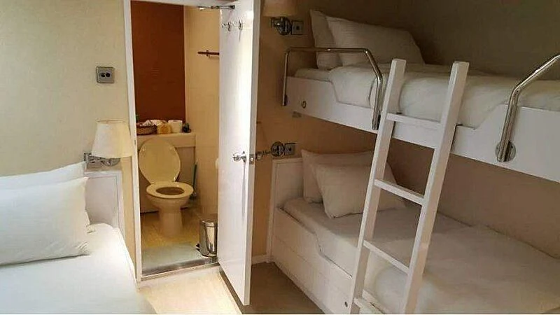 a small bathroom with a bunk bed aboard LANGKAWI LADY Yacht for Sale