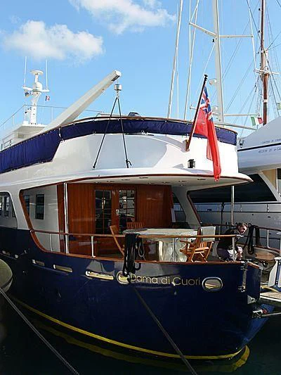 a boat with a flag on the front aboard DAMA DI CUORI Yacht for Sale