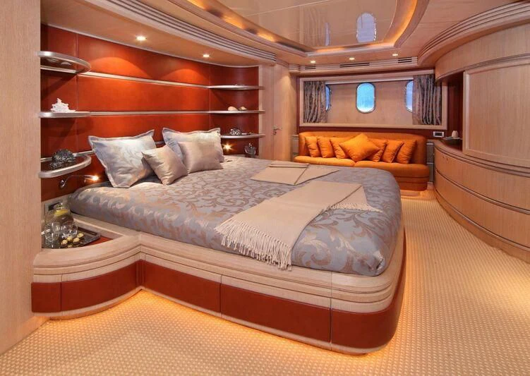 a bed in a room aboard SKAZKA Yacht for Sale