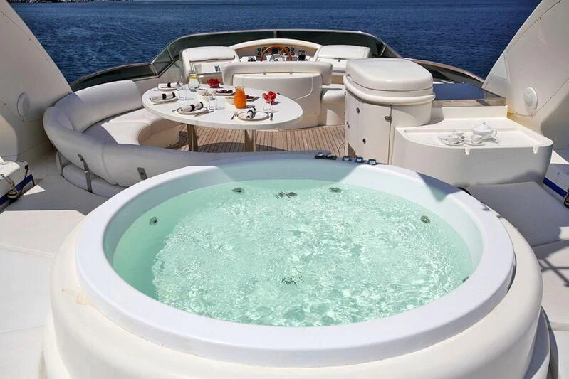 a tub with a blue and white object in it aboard SKAZKA Yacht for Sale