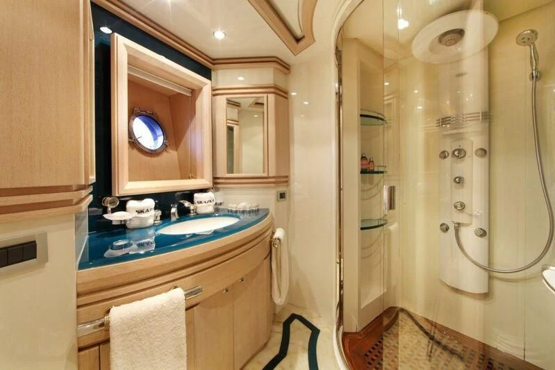 a bathroom with a sink and a mirror aboard SKAZKA Yacht for Sale