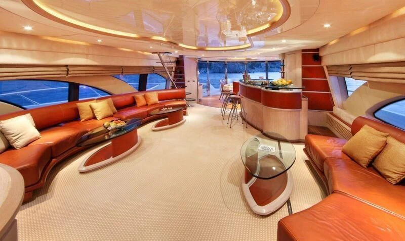 a living room with a large window aboard SKAZKA Yacht for Sale