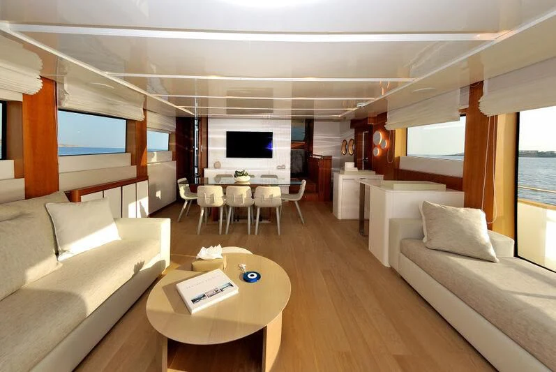 a living room with a large window aboard FUNSEA Yacht for Sale