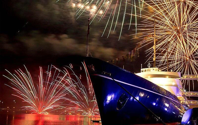 a space ship with fireworks in the background aboard BRITANNIA Yacht for Sale