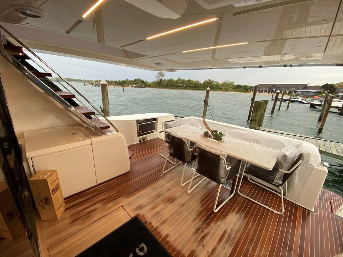 a room with a table and chairs aboard SUNSATION Yacht for Sale
