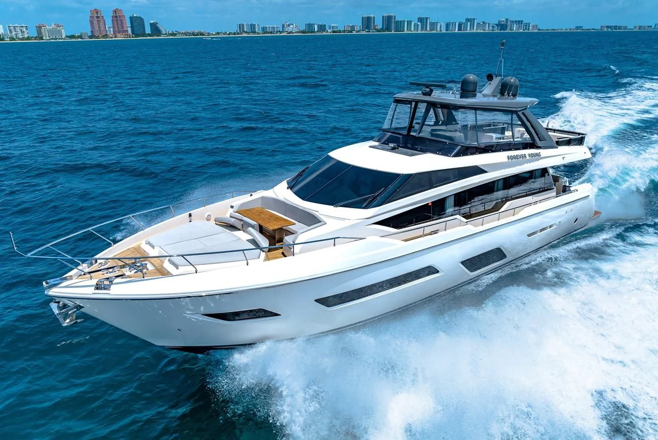 a white yacht on the water aboard SUNSATION Yacht for Sale
