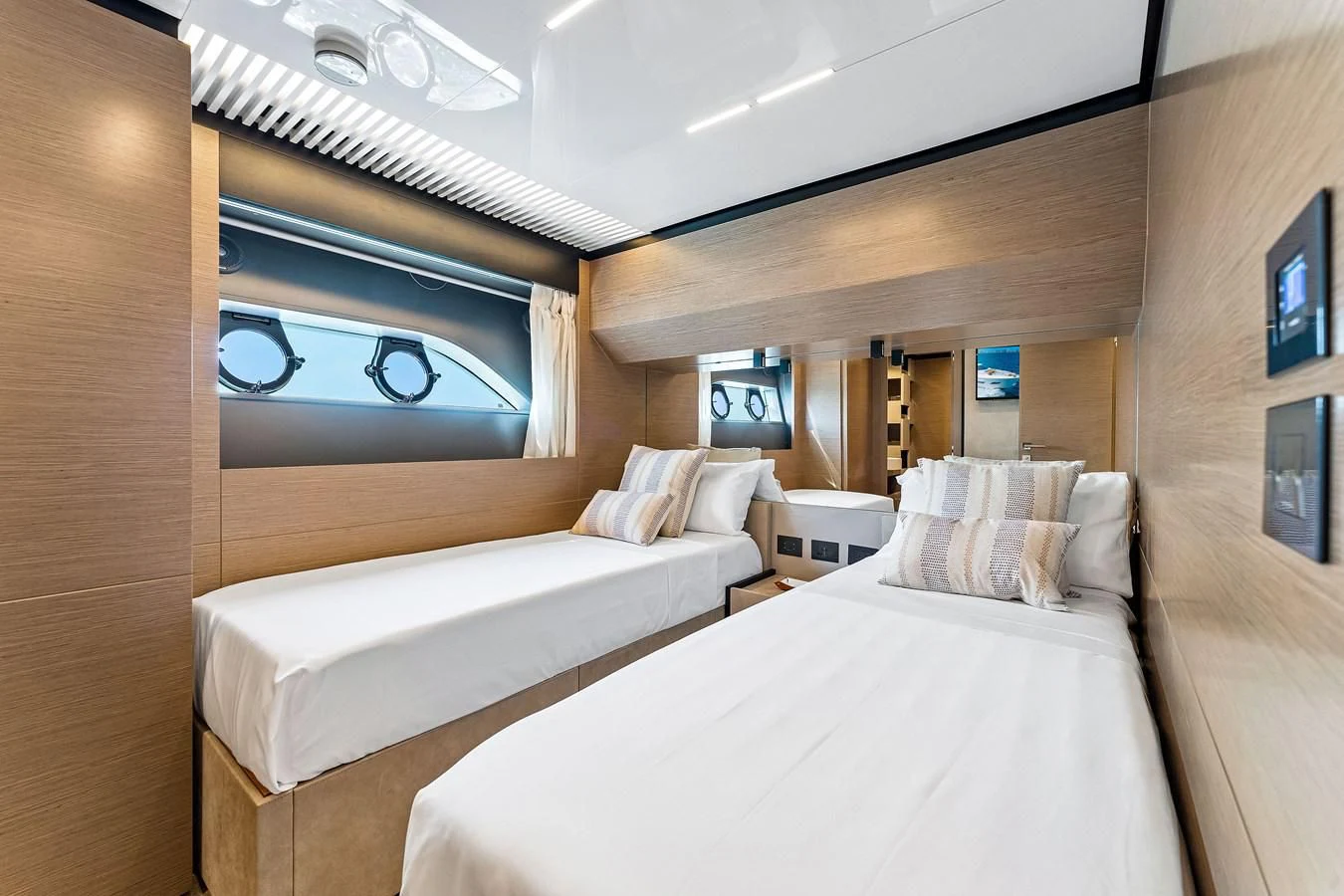 a room with two beds aboard SUNSATION Yacht for Sale