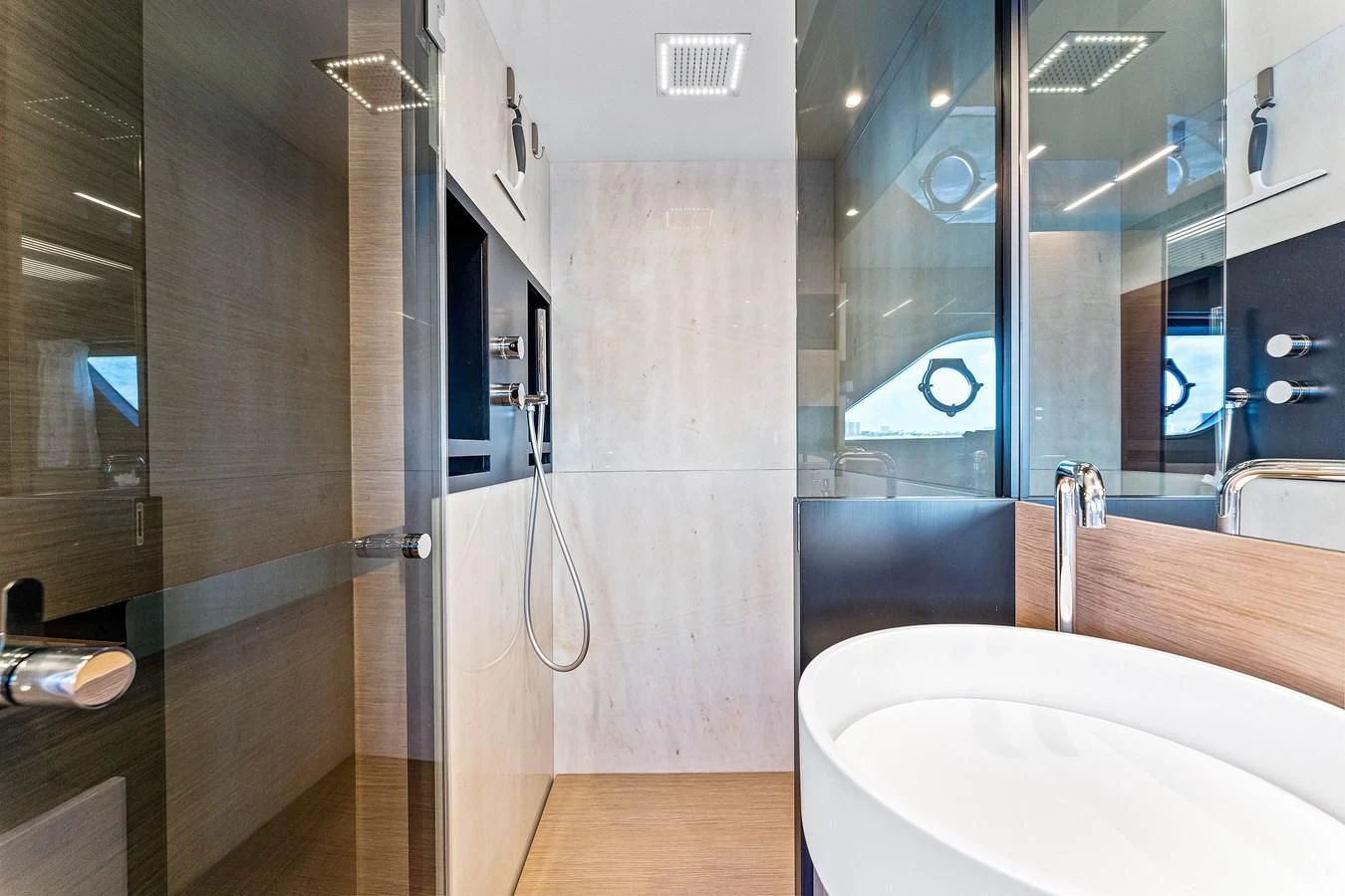a bathroom with a sink and a mirror aboard SUNSATION Yacht for Sale