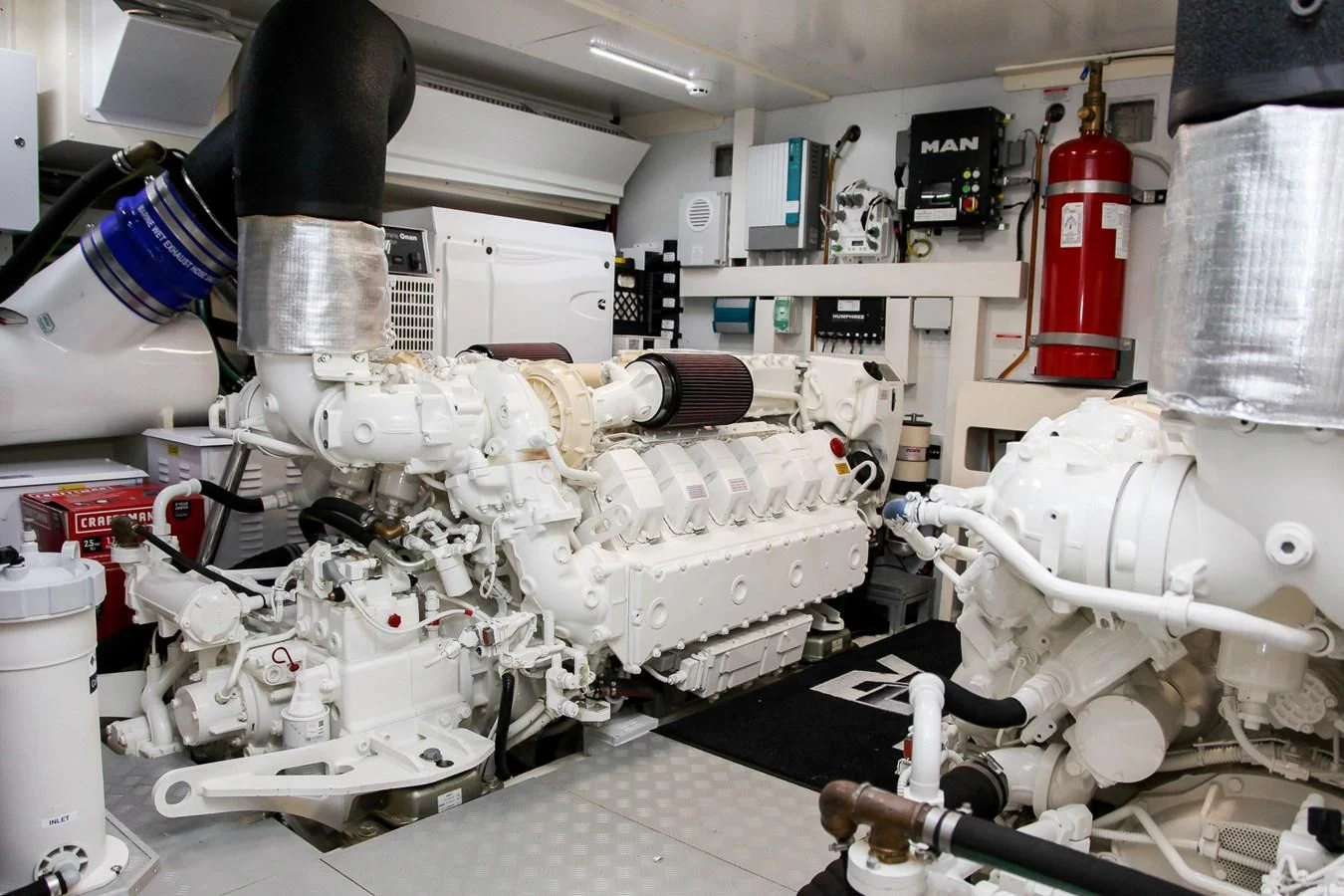 a person working on a machine aboard SUNSATION Yacht for Sale
