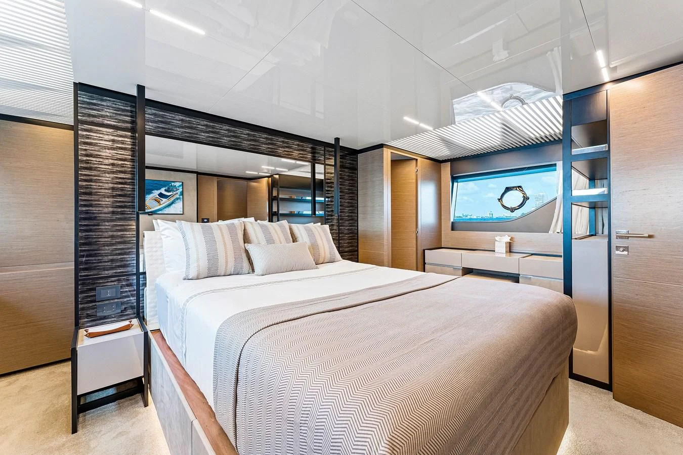a room with a bed and a television aboard SUNSATION Yacht for Sale