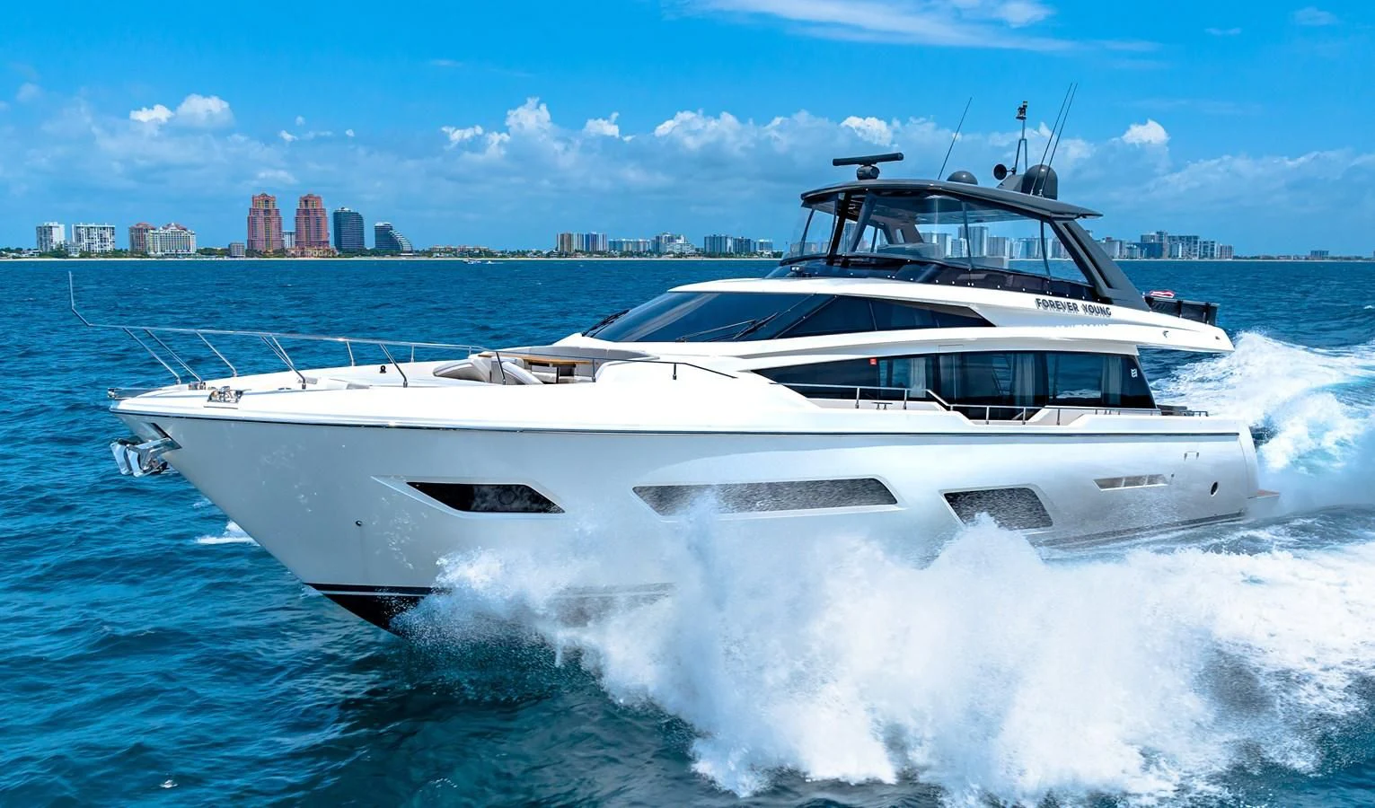 a white yacht on the water aboard SUNSATION Yacht for Sale
