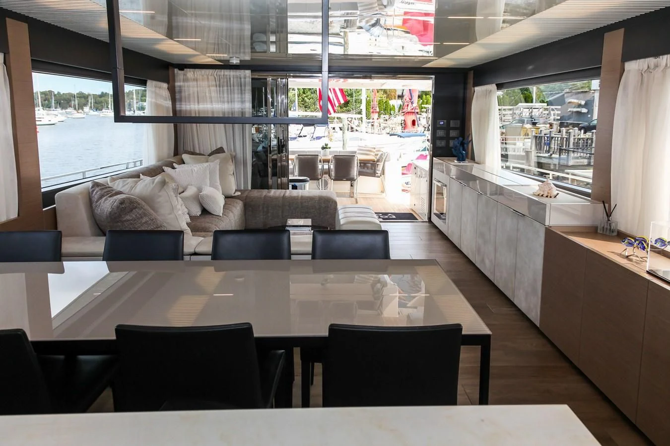 a large room with a table and chairs aboard SUNSATION Yacht for Sale