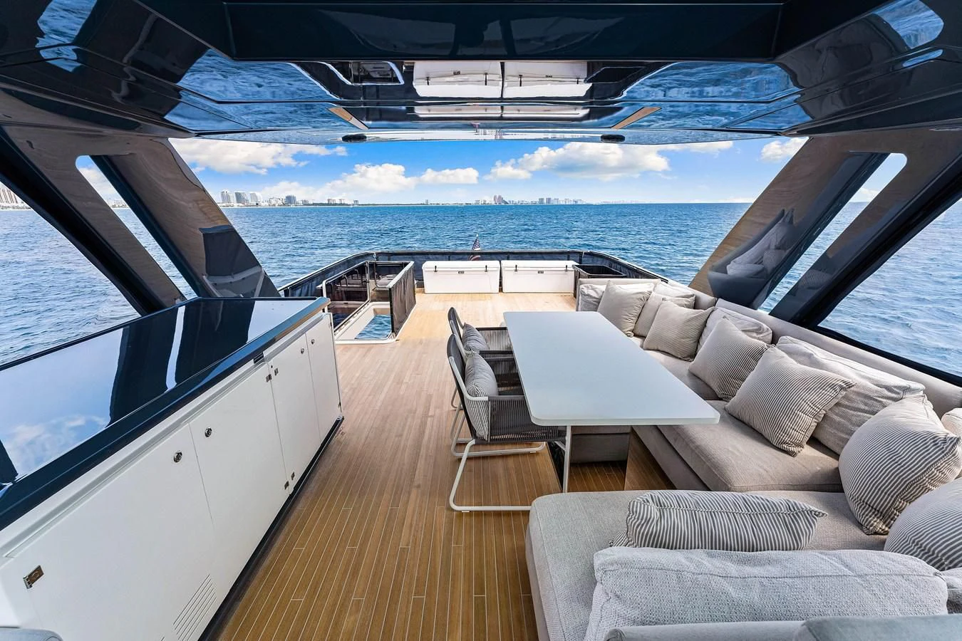 a deck with a view of the ocean and the deck aboard SUNSATION Yacht for Sale
