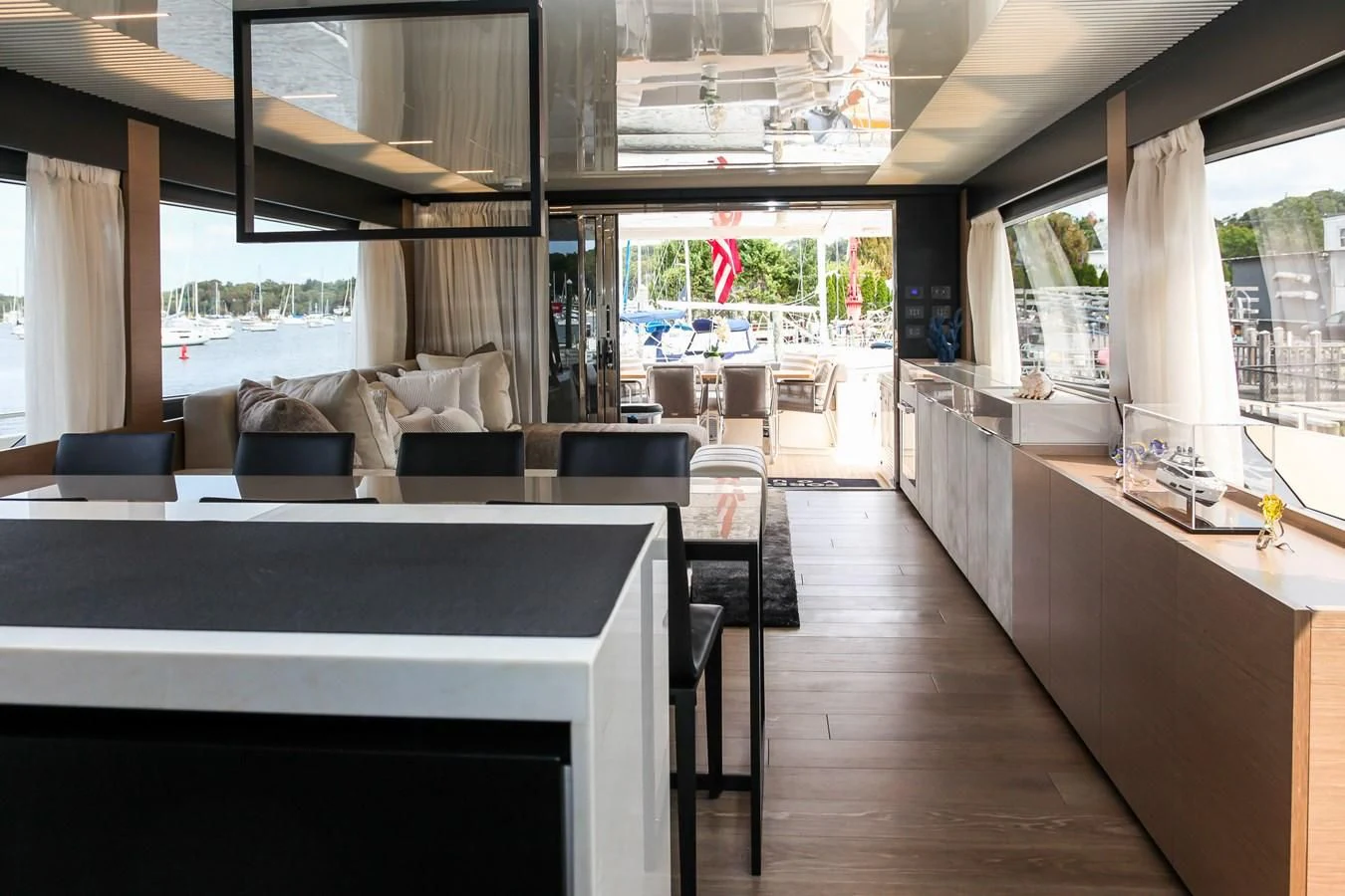 a room with a table and chairs aboard SUNSATION Yacht for Sale