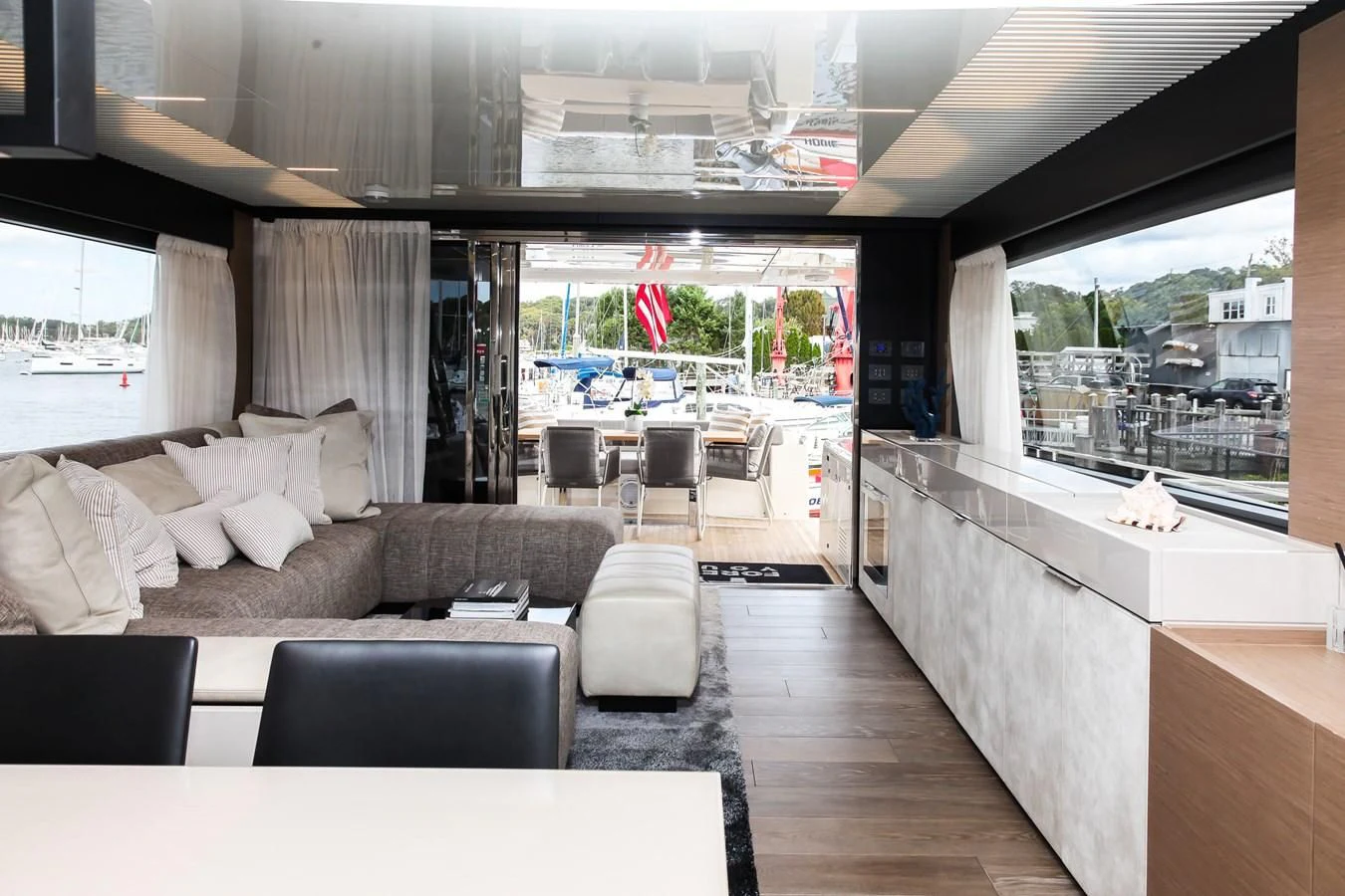 a living room with a large window aboard SUNSATION Yacht for Sale