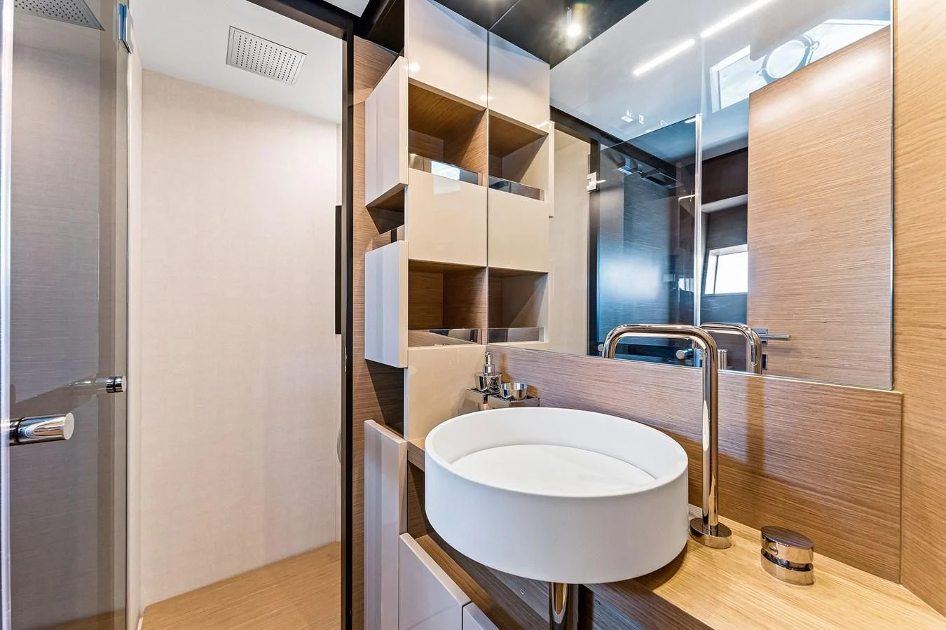 a bathroom with a sink and a mirror aboard SUNSATION Yacht for Sale