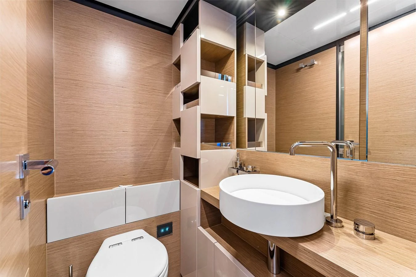 a bathroom with a sink and a mirror aboard SUNSATION Yacht for Sale