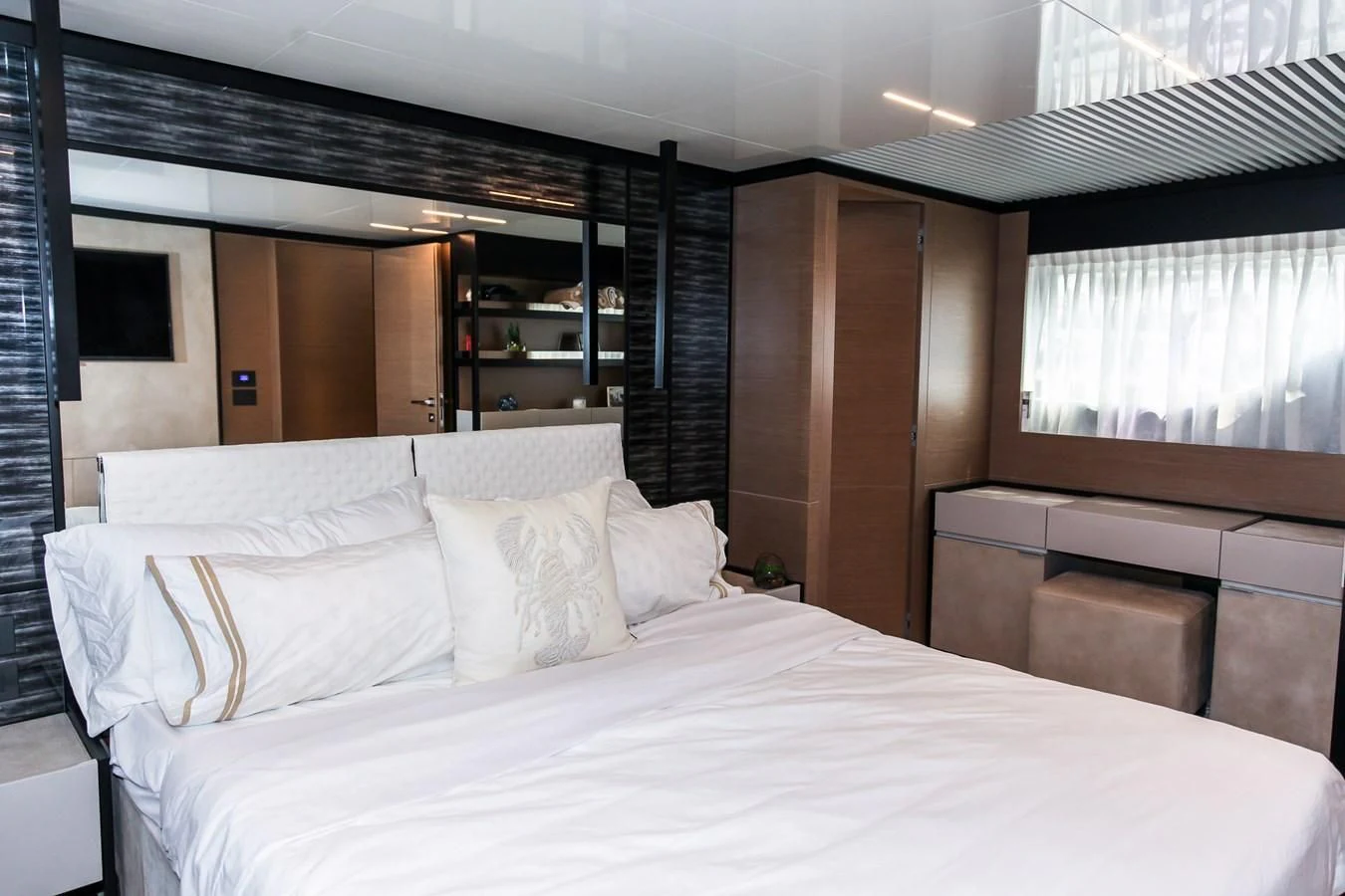 a bed with white sheets aboard SUNSATION Yacht for Sale