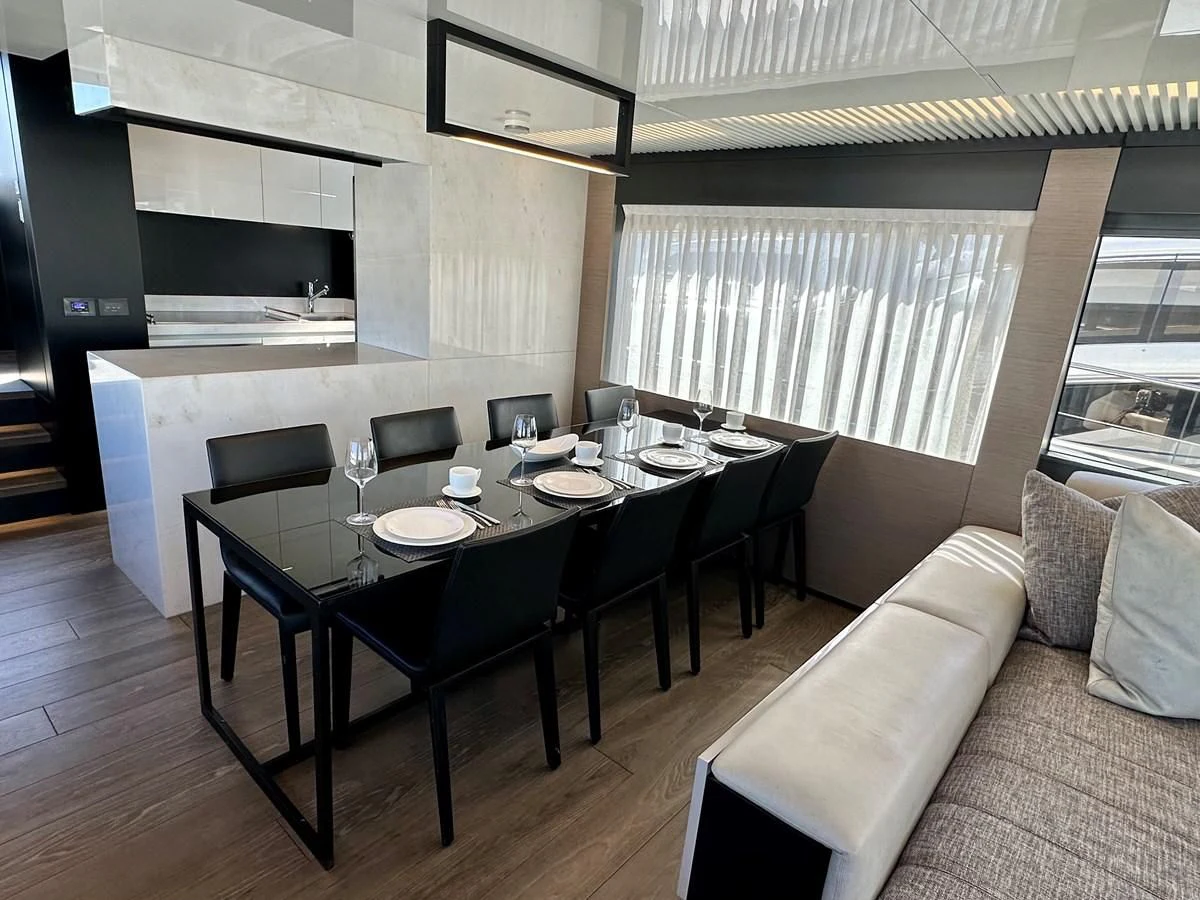 a dining table in a room aboard SUNSATION Yacht for Sale