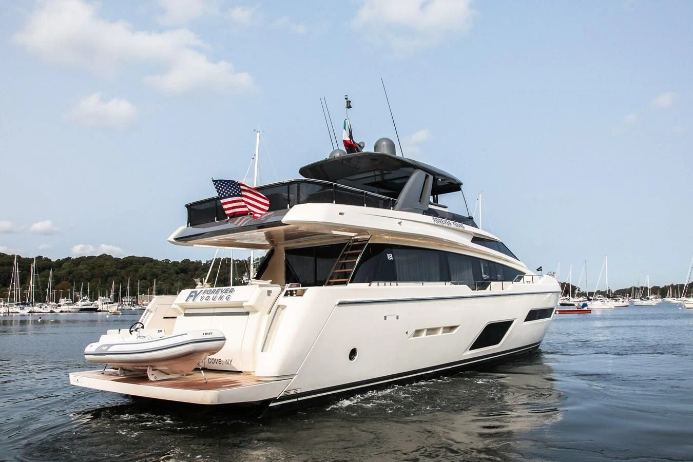 a large white boat in the water aboard SUNSATION Yacht for Sale