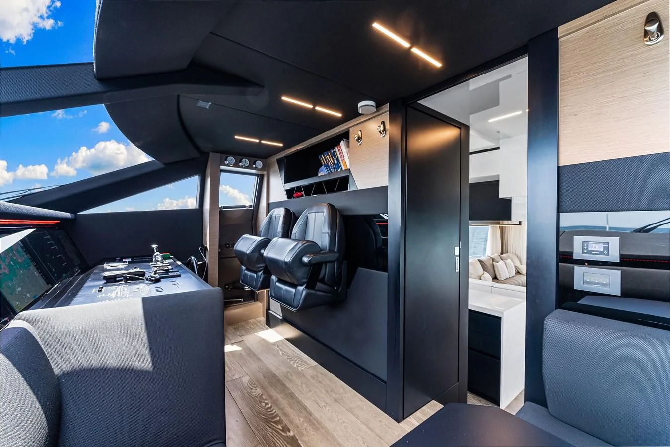 a room with a bed and a desk aboard SUNSATION Yacht for Sale