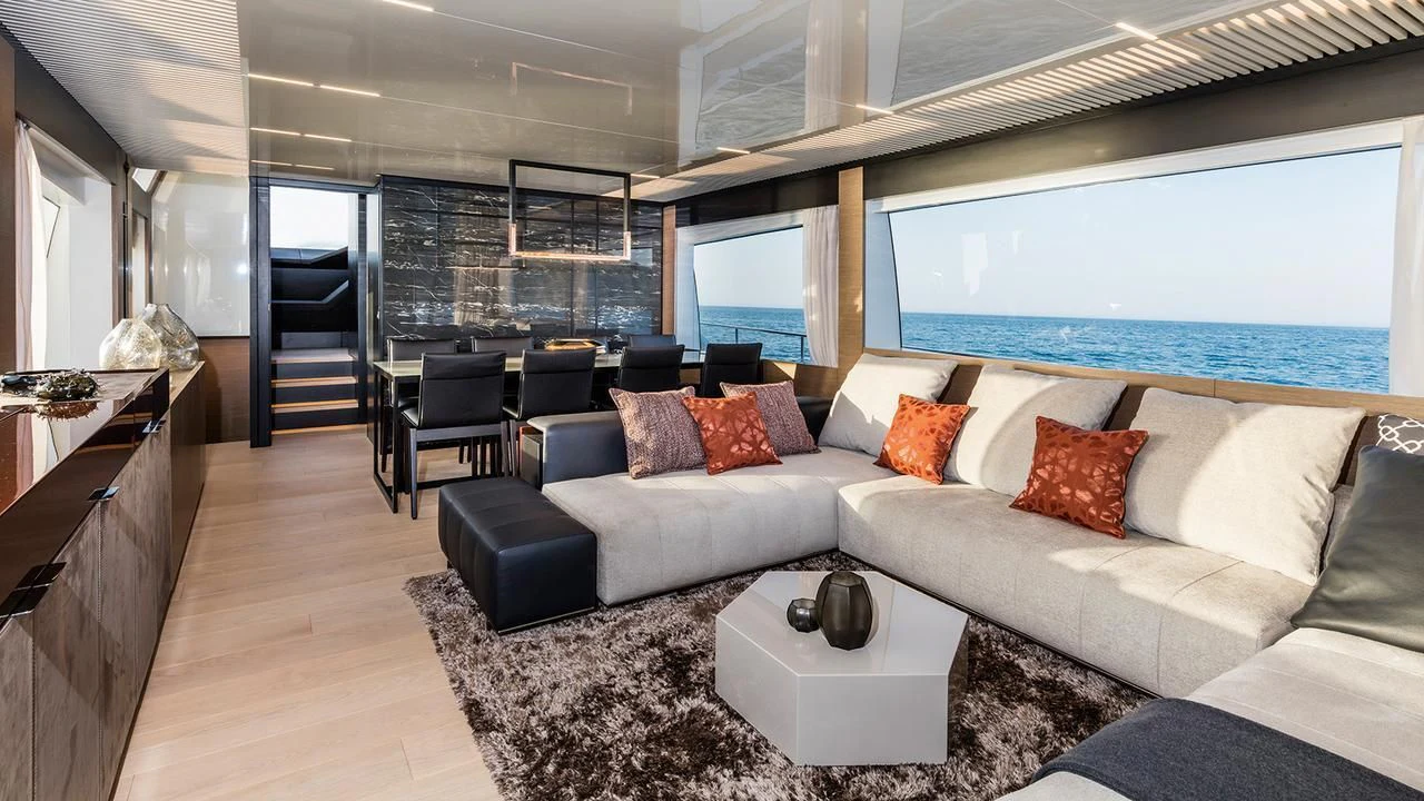 a living room with a large window aboard SUNSATION Yacht for Sale