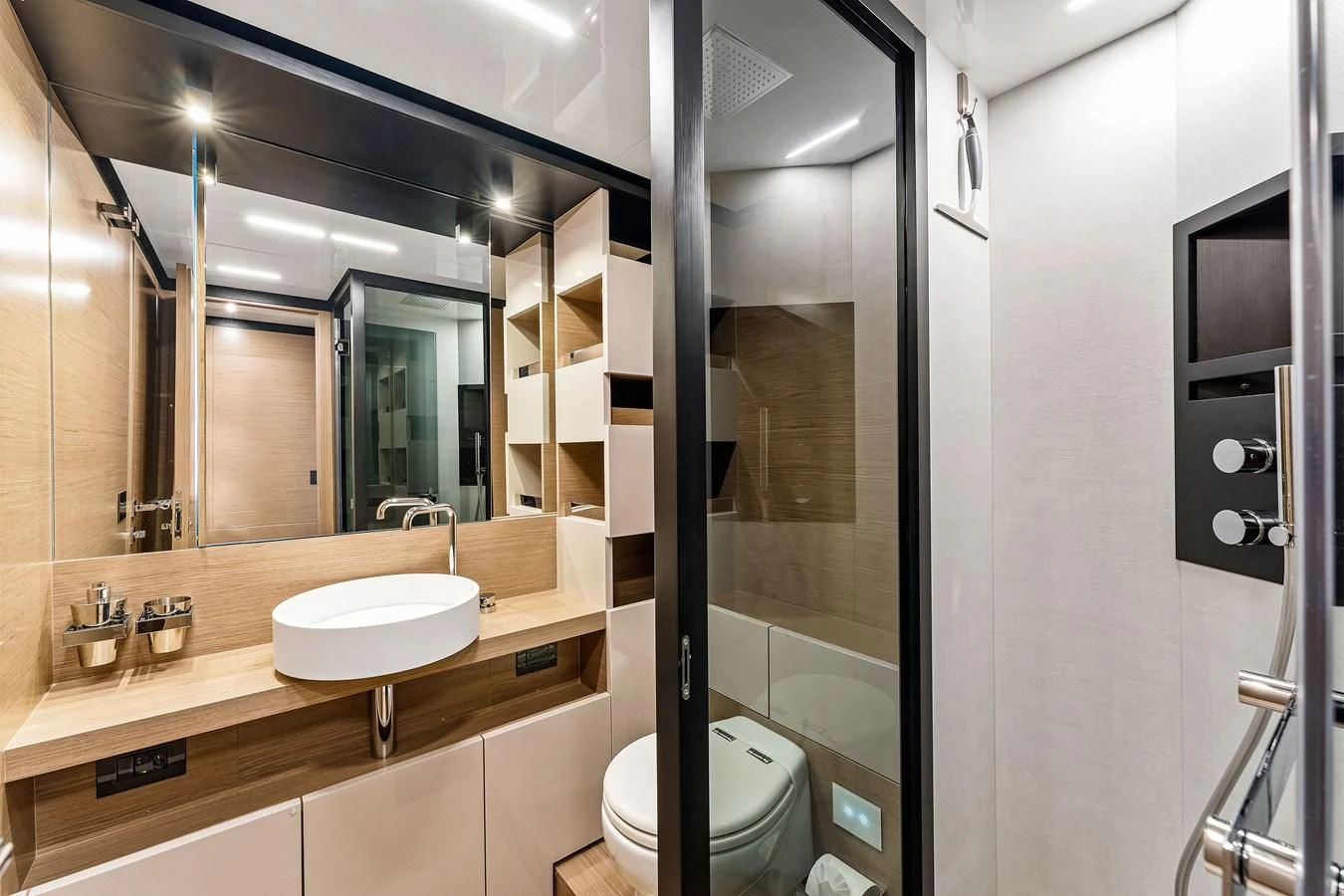 a bathroom with a large mirror aboard SUNSATION Yacht for Sale