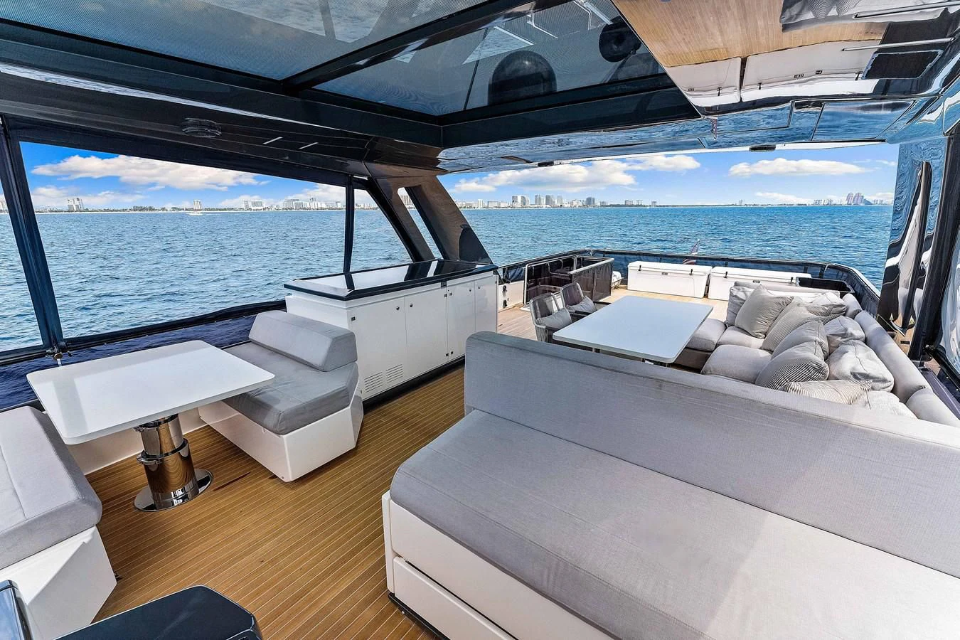 a room with a bed and a table aboard SUNSATION Yacht for Sale